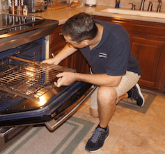 technician repairing appliance